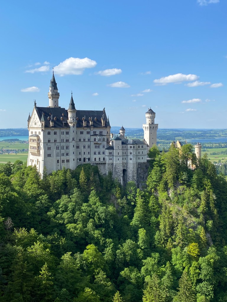 This is a picture of the Neuschwanstein castle in Germany, taken on the Marien bridge across from it.