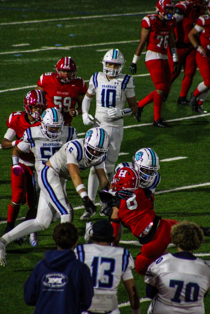 Nathan Da Rosa (12) - Senior safety Maddox Nazzizi (4) makes a tackle on the Haybalers, leading to a 4th down punt from the other team.